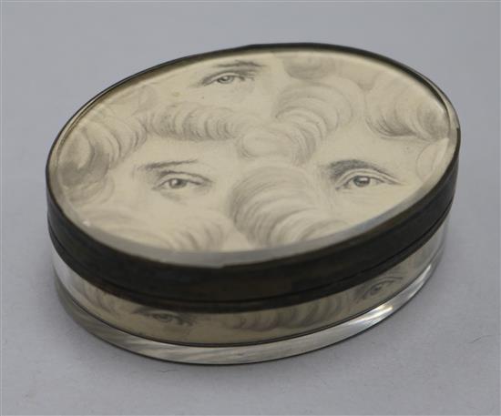 An early 19th century silver oval snuff box, top underside painted with eyes